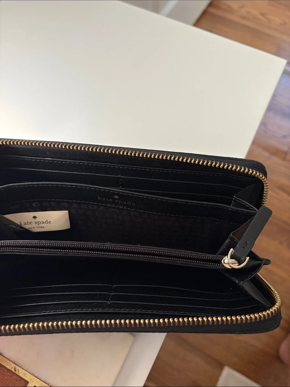 kate spade Black Pebbled Zip-Around Wallet with Gold Plaque
